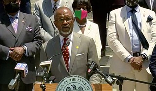 A raft of Democratic legislators joined House Democratic Leader Rep. Robert Johnson III in calling for a new state flag yesterday. Photo WLBT Screenshot