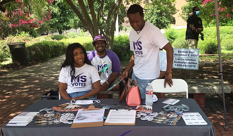 Members of Mississippi Votes set up a stand at a voter-registration event June 28 at Jackson City Hall. Photo by Kayode Crown