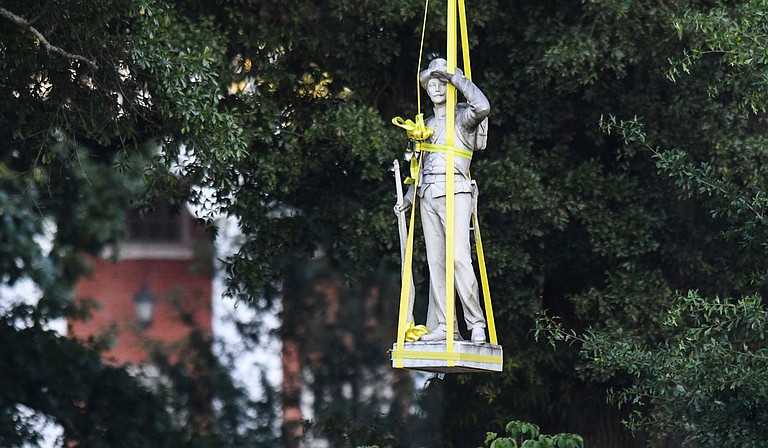 A Confederate monument that’s long been a divisive symbol at the University of Mississippi was removed Tuesday from a prominent spot on the Oxford campus, just two weeks after Mississippi surrendered the last state flag in the U.S. with the Confederate battle emblem. Photo courtesy Bruce Newman via AP