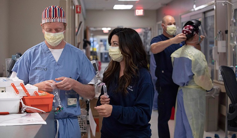 Dr. Andy Wilhelm and RN Ashley Moore’s medical intensive-care unit is strained to capacity with coronavirus patients. Photo courtesy UMMC Communications