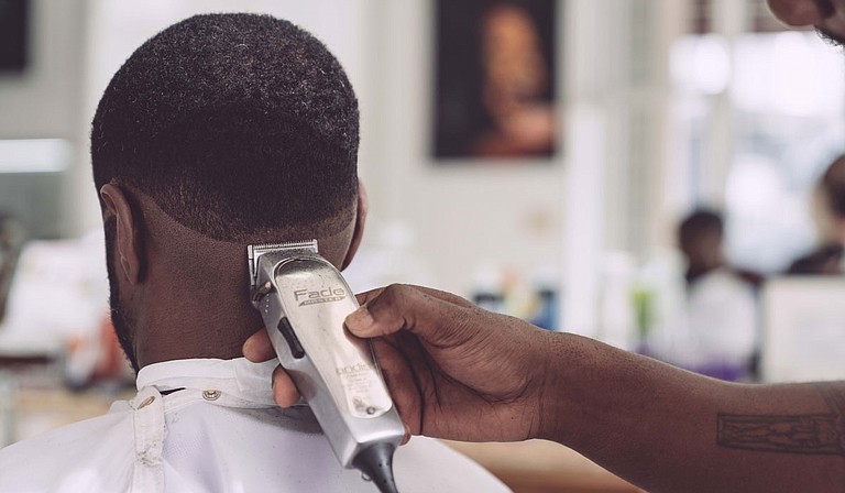 The barber’s chair may be the new therapy couch for parts of the South where mental health care is in short supply. Photo by Edgar Chaparro on Unsplash