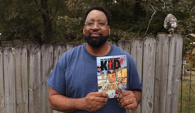 Local artist Christopher Windfield holds a first-edition copy of his debut graphic novel, “KIDs: Killers in Disguise,” which released earlier this year and is available on Amazon. Photo courtesy Christopher Windfield
