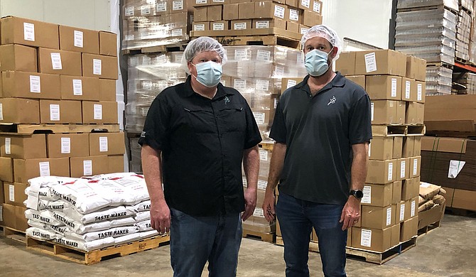 Jeffrey Reed (left) and Justin Reed (right), sons of original owner R.J. Reed,  presently own and operate their father’s spice- and sauce-blending business. Photo courtesy Reed Food Technology