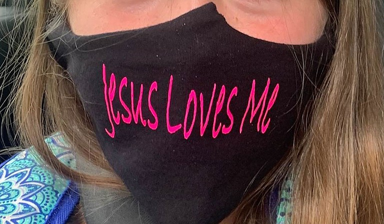 A Mississippi couple is suing a school district because they say their 9-year-old daughter was told she could not wear a mask with the phrase “Jesus Loves Me.” Photo courtesy Alliance Defending Freedom