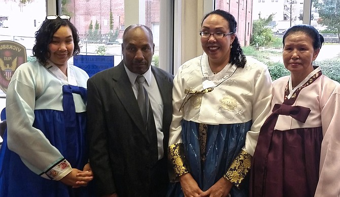 Angela Reddix first had to argue with her father, George Long, to get him to take COVID-19 seriously. It was love for his wife and grandchildren that convinced him to cancel Thanksgiving. From left: Selina Long, George Long, Angela Reddix and Yu-Sun Long. Photo courtesy Reddix Family