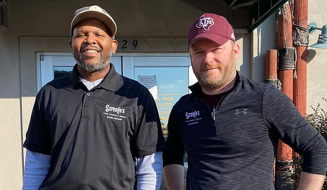 For the last six years, Chris Jefferson (left) and Chris Carter (right) have owned and operated Scrooge’s, which will be open on Christmas Day. Photo courtesy Scrooge's