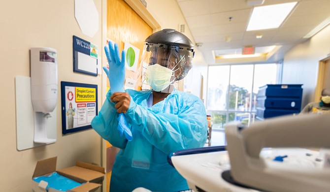 Jasmine Watson is a registered nurse at the University of Mississippi Medical Center’s 
2 North unit, which is consumed entirely with COVID-19 patients. The immense stress of the pandemic is a constant pressure on Watson and her colleagues. Photo courtesy UMMC Communications