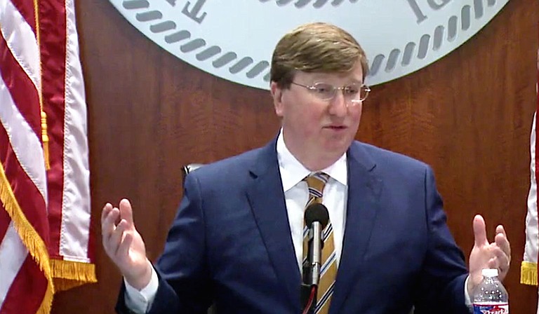 On the same day that saw 2,457 new COVID cases, Gov. Tate Reeves told reporter Nick Judin he was wrong that it was a new peak. In fact, Reeves was wrong. Photo courtesy State of Mississippi