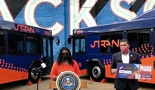 Deputy Director of Transportation Christine Welch presents details of the proposed JTRAN transit study. Mayor Chokwe A. Lumumba holds the promotional material. Photo courtesy City of Jackson