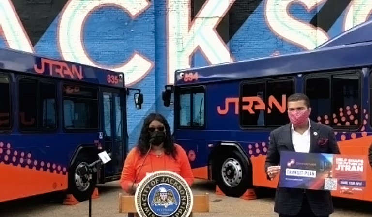 Deputy Director of Transportation Christine Welch presents details of the proposed JTRAN transit study. Mayor Chokwe A. Lumumba holds the promotional material. Photo courtesy City of Jackson