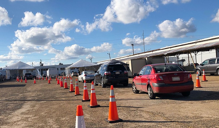 The Mississippi Department of Health has a number of free COVID-19 testing options, including this drive-thru one at the West Street Farmers Market. Photo by Kristin  Brenemen