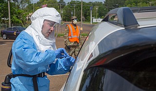 U.S. Air Force Senior Airman Jacob Cranston explains testing procedures to a patient at a mobile testing site in Natchez. “Vaccination Day” is one of several planned events to promote vaccinations among Jackson’s vulnerable population who may have difficulty otherwise obtaining them from other sites.
U.S. National Guard photo by Spc. Jovi Prevot