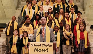 Grant Callen, president of “school choice” advocacy group Empower Mississippi, speaks before a crowd at the Capitol at the beginning of National School Choice Week in February. Photo by Imani Khayyam