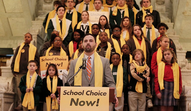 Grant Callen, president of “school choice” advocacy group Empower Mississippi, speaks before a crowd at the Capitol at the beginning of National School Choice Week in February. Photo by Imani Khayyam