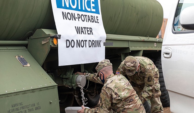 Water for flushing toilets was being distributed at seven sites in Mississippi’s capital city—more than 10 days after winter storms wreaked havoc on the city’s water system. Army National Guard Photo by Sgt. Jovi Prevot