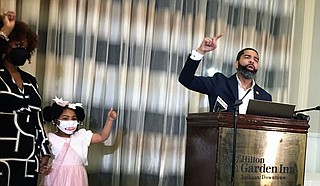 Mayor Chokwe A Lumumba, flanked by his family at the Hilton Garden Inn, celebrated his win in the Democratic Primary election Tuesday. He won with 69% of the votes. Photo by Kayode Crown