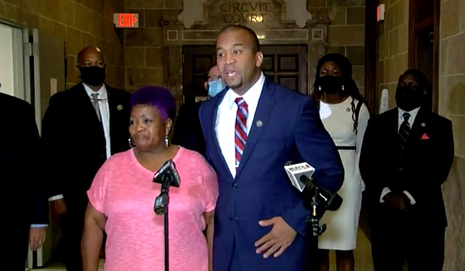 District Attorney Jody Owens (right) with George Robinson’s sister Bettersten Wade at a media briefing on Thursday, May 20, after Judge Faye Peterson dismissed the murder case against two police officers indicted for Robinson’s murder. Photo courtesy WLBT3