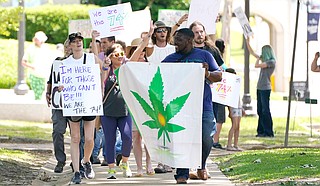 Protesters gathered outside the Mississippi Capitol and Supreme Court to demand that Gov. Tate Reeves call a legislative special session in order to bring back the medical-marijana initiative voters passed last November. Photo by Rogelio V. Solis via AP