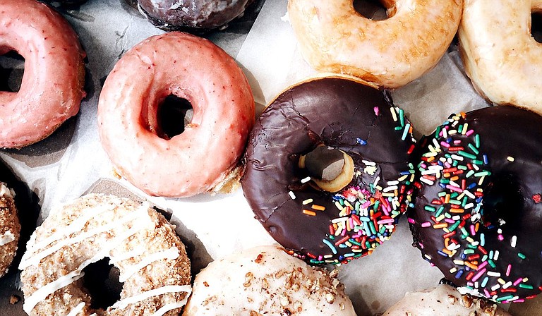 The Belhaven Town Center recently announced that New Orleans-based District Donuts Sliders Brew will take over the space that formerly housed Campbell's Craft Donuts during summer 2021. Photo courtesy Anna Sullivan on Unsplash