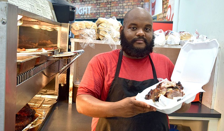Growing up, Roche Jefferson enjoyed watching his grandmother and mother cook and has since opened his own barbecue business, Jefferson’s Grill, which currently resides within a Velero station on Old Canton Road. Photo courtesy Shaye Smith