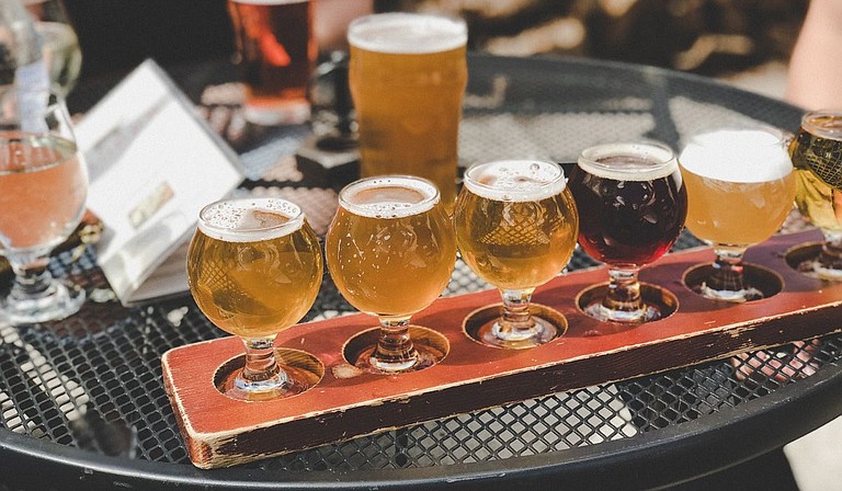 Drinking cold craft beers across Mississippi is one way to get out again. Photo courtesy Tatiana Rodriguez on Unsplash