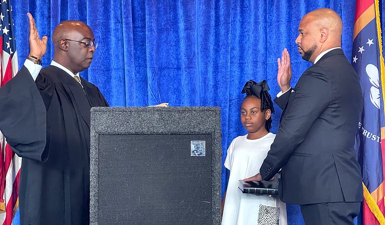 Hinds County Circuit Court Judge Winston Kidd (left) swore in the National Bar Association President Carlos Moore at the Capital Club in Jackson, Miss., on Tuesday, July 27, 2021. Photo by Kayode Crown