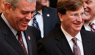 Mississippi House Speaker Philip Gunn, left, and Gov. Tate Reeves, right, told attendees at the Neshoba County Fair on July 29, 2021, that they both supported an effort to ban critical race theory in Mississippi's public schools. Reeves has admitted that he does not know of any public school that teaches critical race theory, a legal framework typically taught in law schools or advanced college sociology courses. Photo by Ashton Pittman