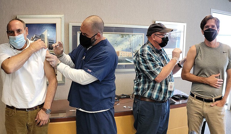 State Health Officer Dr. Thomas Dobbs and State Epidemiologist Dr. Paul Byers received their seasonal flu shots as shown in this Oct. 18 photo from the Mississippi State Department of Health. They encourage Mississippians to join them in getting their flu shots this season. Photo courtesy MSDH