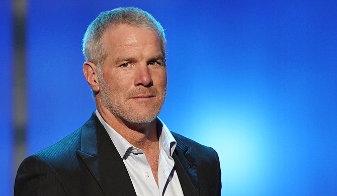 Having repaid $600,000 in state welfare money he previously accepted for speeches where he didn't appear, retired NFL player Brett Favre is not facing criminal charges. Photo by Paul Abell Invision for NFL / Associated Press