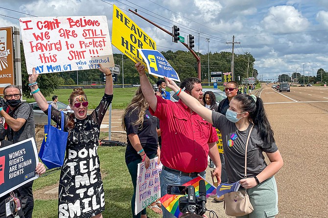 A decade after a majority of Mississippians voted against the Personhood Amendment, abortion rights organizers and activists continue fighting efforts to ban access to the procedure in the Magnolia State. Activists seen here clashed with a group of street preachers when they held a protest in Jackson to show support for abortion rights on Oct. 3, 2021. Photo by Ashton Pittman