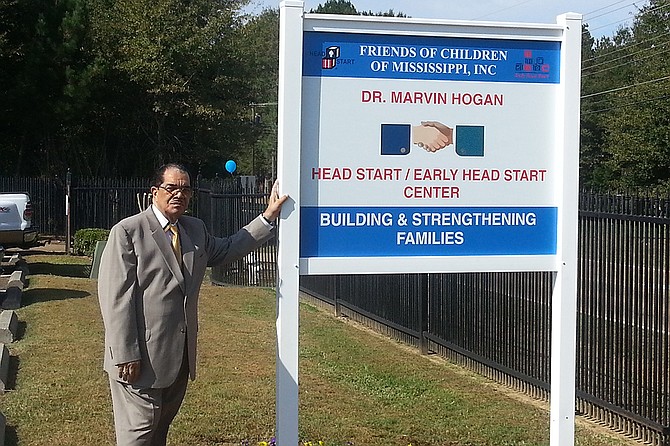 Dr. Marvin Hogan poses outside a Head Start center bearing his name in Flora, Miss. Courtesy Beverly Wade Hogan
