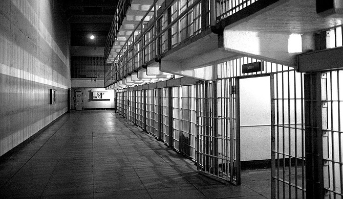Thousands of people in Mississippi continue to be jailed for long periods while waiting to go on trial because they are too poor to afford bail, judges may deny bail altogether or public defenders might not be available when they're needed, according to a new report from a group that advocates for the rights of the incarcerated. Photo courtesy Emiliano Bar on Unsplash