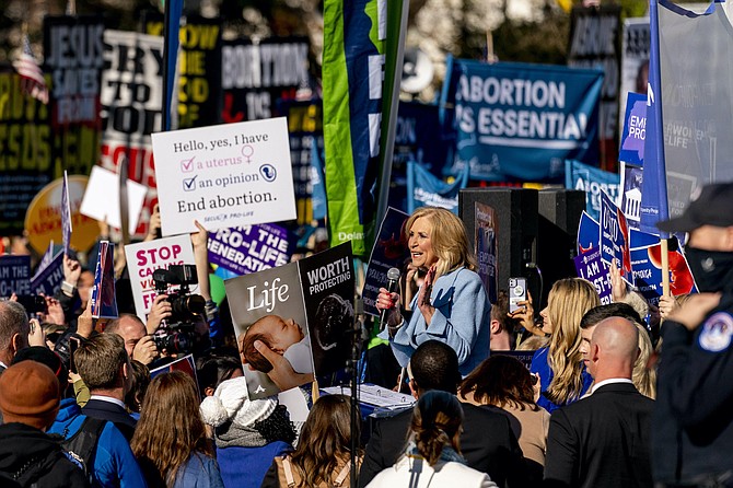 Mississippi Attorney General Lynn Fitch speaks to anti-abortion protesters in front of the U.S. Supreme Court, Wednesday, Dec. 1, 2021, in Washington, after the court hears arguments in a case from Mississippi, where a 2018 law would ban abortions after 15 weeks of pregnancy, well before viability. The Alliance Defending Freedom drafted the legislation before Mississippi lawmakers passed it. Anti-abortion groups and Christian dominionists hope the case, Dobbs v. Jackson Women's Health Organization, will lead to the overturn of Roe v. Wade. AP Photo/Andrew Harnik