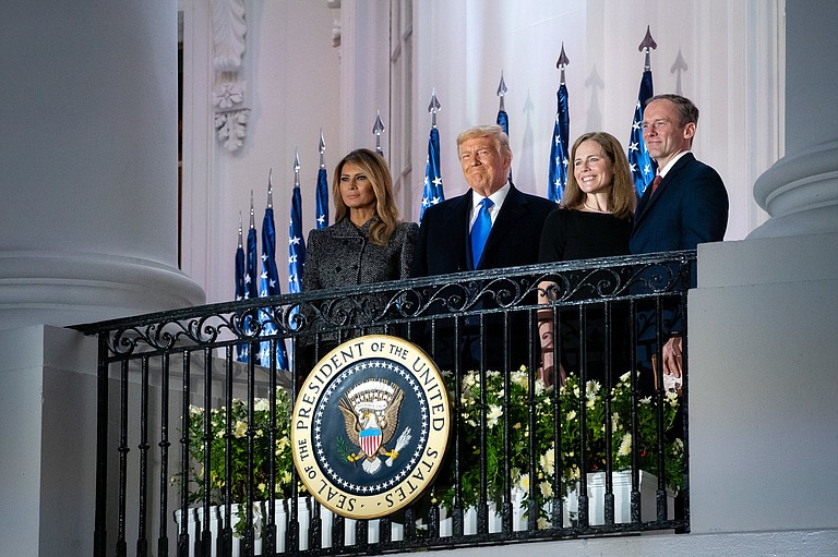 Days before the 2020 presidential election, then-President Donald Trump celebrated the confirmation of Justice Amy Coney Barrett to the U.S. Supreme Court, achieving a top priority of many Christian dominionist leaders who supported him. Pictured from left to right on the White House Blue Room Balcony: Then-First Lady Melania Trump; President Trump; Justice Amy Coney Barrett and husband Jesse Barrett. Photo by Joyce N. Boghosian/Trump White House