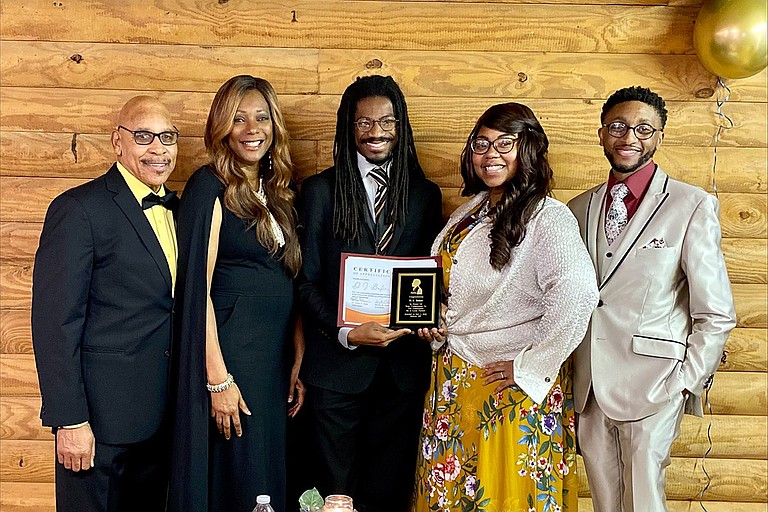(From left) Dr. Joe Amos, Dr. Kathy Amos, D.J. Baker, Monica Nicole Cable, and Dr. Joshua A. Cable pose at the award ceremony that Cable and Best of Mississippi held at the Mississippi Agriculture and Forestry Museum on Feb. 1, 2022. Photo courtesy Kathy Amos