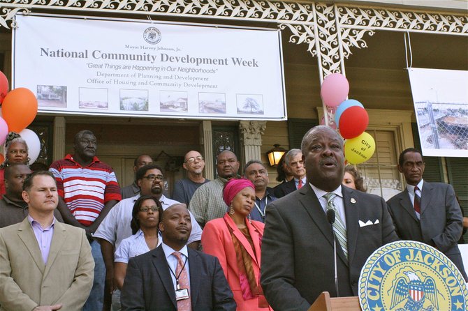 Mayor Harvey Johnson Jr. speaks to citizens in front of the Municipal Art Gallery on Monday to kick off National Community Development Week.