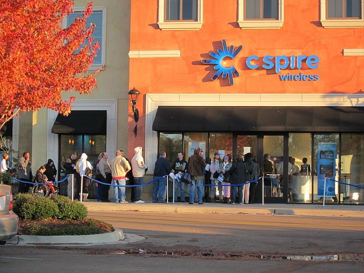 Customers wait outside the C Spire store in Ridgeland to purchase iPhones last fall.