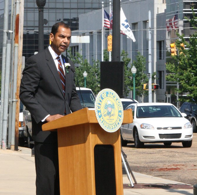 FBI Special Agent Daniel McMullen speaks to the crowd at a ceremony Tuesday honoring fallen police officers outside.