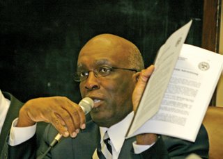 Rep. Percy Watson, D-Hattiesburg, holds a 2007 PEER report criticizing the state's lack of oversight on awarding advertising bids.
