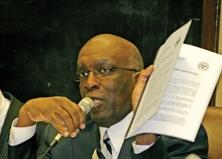 Rep. Percy Watson, D-Hattiesburg, holds a 2007 PEER report criticizing the state's lack of oversight on awarding advertising bids.