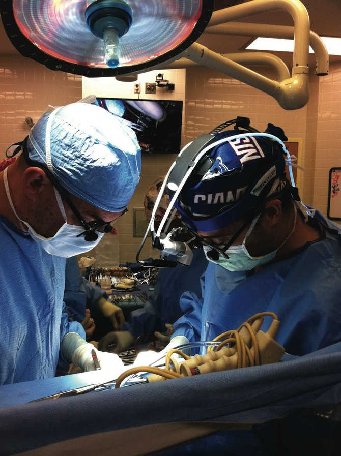 Dr. Jorge Salazar (left) and Dr. Daniel DiBardino perform complex procedures on children with heart defects at the Blair E. Batson Hospital for Children.