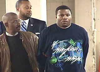 Sharrod Moore (right) is in jail awaiting trial for the murder of R.J. Washington.