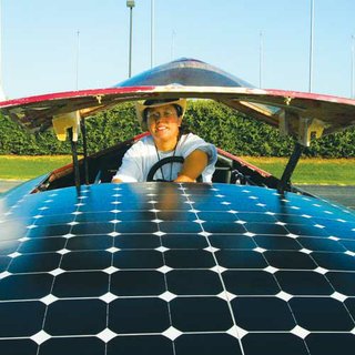 Trasilla Willis behind the wheel of the solar-powered Tuska Hashi car, winner of the 15th Hunt-Wilson Solar Car Challenge for high-school teams.