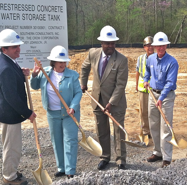 Mayor Harvey Johnson Jr. (second from right) breaks ground with employees of The Crom Corp. on a new surface water-storage facility on TV Road in southwest Jackson.