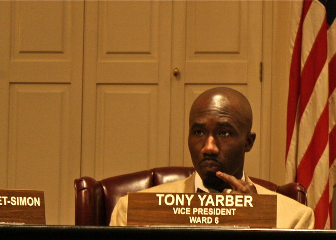 Ward 6 City Councilman Tony Yarber listens as council members speak during a meeting in City Hall.
