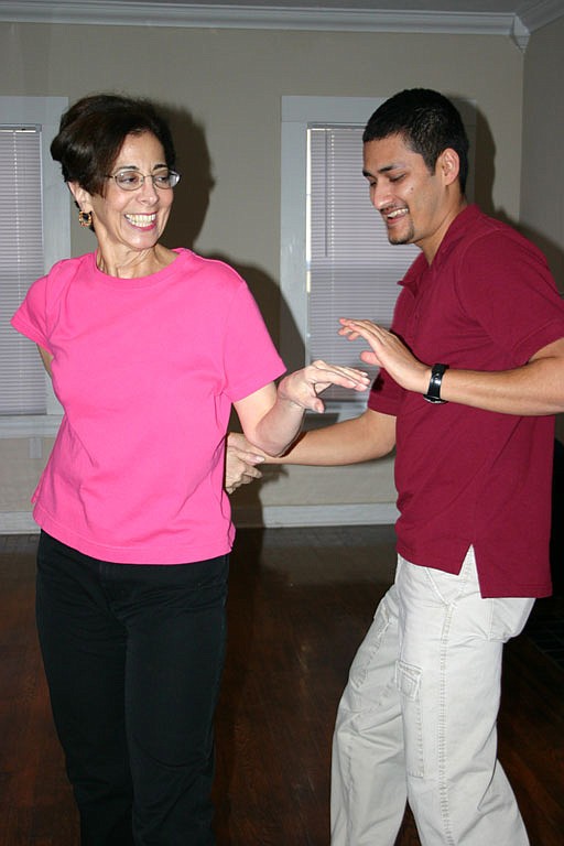 Salsa Mississippi instructor Sujan Ghimire gives a private lesson to one of his students, Joel Escude.