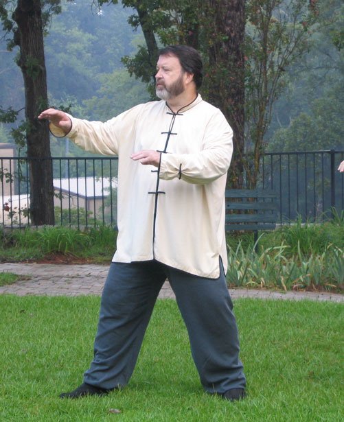 Taiji instructor Stanley Graham leads a Saturday morning group practice in a garden on Ridgewood Road in Jackson.