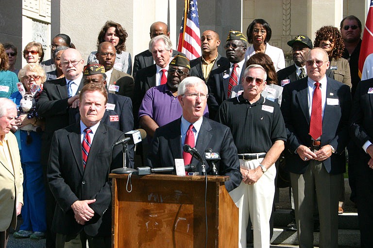 Virginia Sen. Jim Webb (left) says that Ronnie Musgrove (speaking) would serve veterans' interests in the Senate