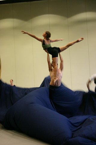 Kenaniah Bystrom, who dances the part of the storm, elevates dancer Scarlett Wynne into the air during a rehearsal of "House of Broken Dreams."