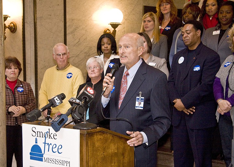 State Health Officer Ed Thompson advocated a statewide ban on public smoking at a Thursday press conference.